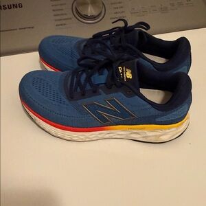 New Balance Blue Sneakers with Yellow and Red Trim